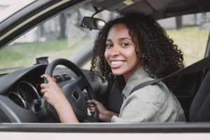 smiling-woman-driving-a-car