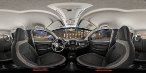 Painel do Fiat Mobi visto em ângulo 360, exibindo de lado a lado os controles, volante multifuncional, central multimídia e detalhes do acabamento interno.