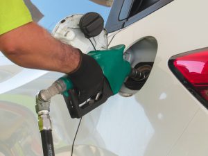 Employee filling the vehicle with Ethanol fuel.