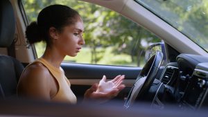 Worried African American woman female girl trying start broken car auto automobile transport driver rental service problem electric battery charge steering crash businesswoman business owner vehicle. High quality 4k footage