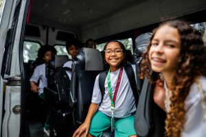 portrait-of-a-schoolgirl-inside-of-school-van