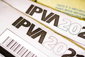 In this photo illustration the the IPVA booklet (Imposto sobre a Propriedade de Veículos Automotores)