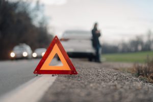warning-triangle-sign-placed-on-road-by-driver-after-car-breakdown-on-country-road