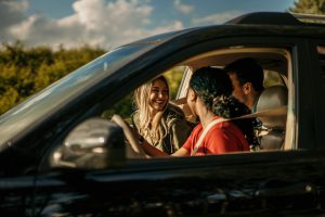 people-laughing-and-talking-during-a-car-trip