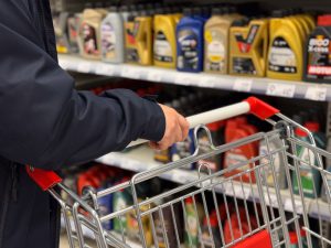 A,Person,Holding,A,Shopping,Cart,In,An,Aisle,Filled