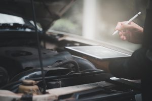 carengineserviceconceptcarmechanicwritingchecklistondigital