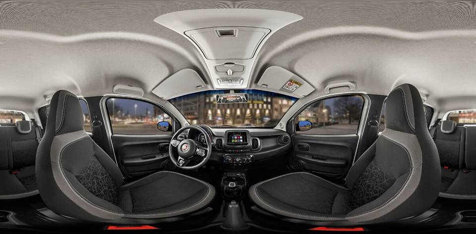 Interior do Fiat Mobi com foco nos bancos dianteiros e traseiros, destacando o espaço compacto da cabine.